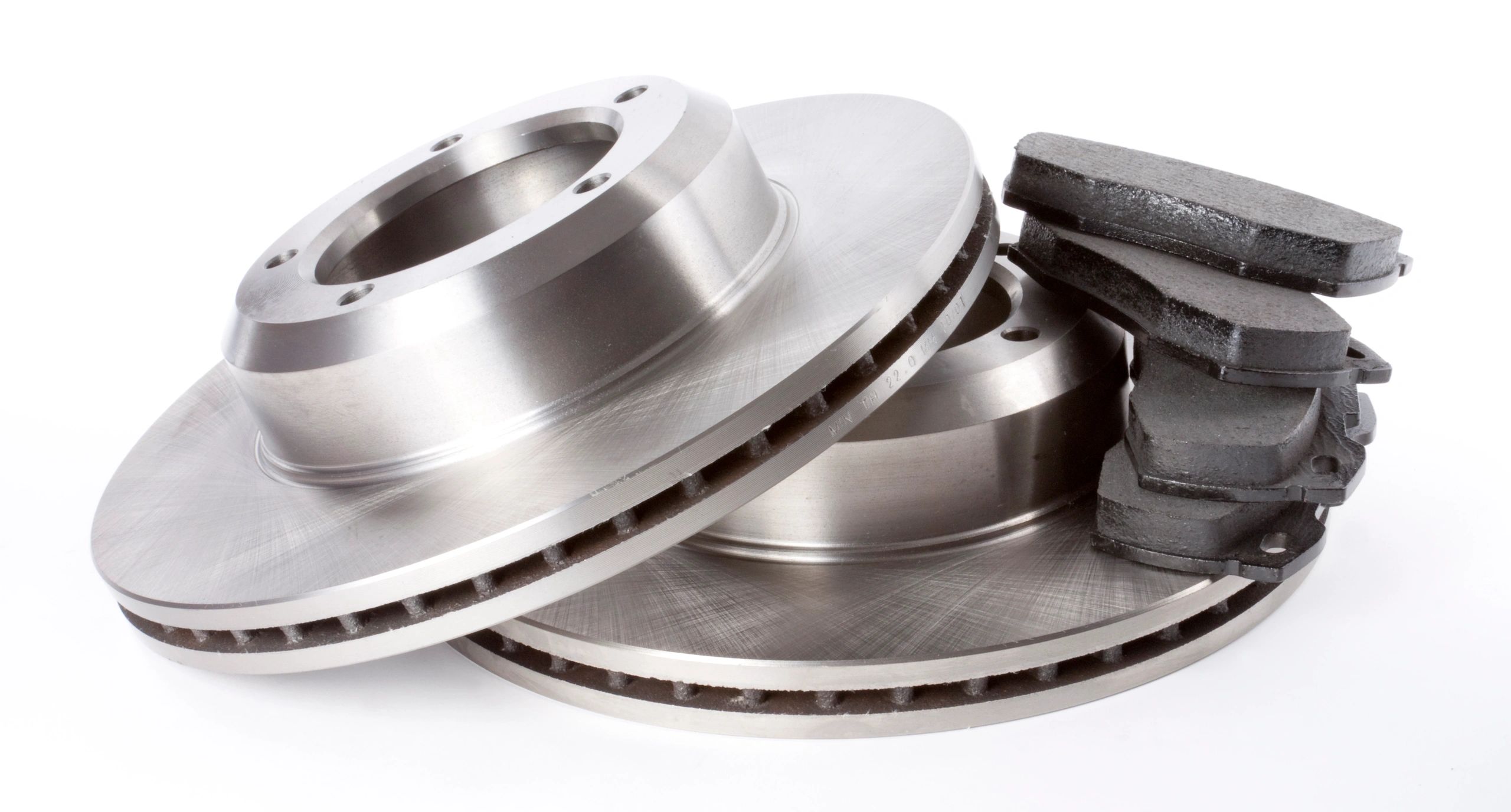 Brake discs and pads on a clean background