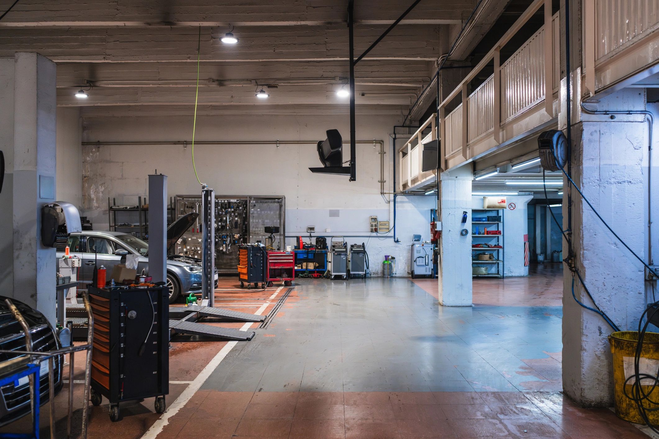 Auto repair shop interior with service bays
